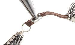 Cord being clamped in a cord tip
